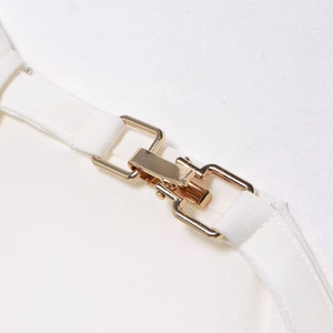 Polished crepe shirt featuring golden shoulder accents and delicate white straps detail