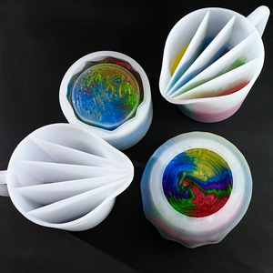 Detail view of multi-slot silicone pouring cups and colorful resin art mixing tools