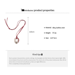 Detail of silver drop pendant on long red leather cord necklace with dimensions