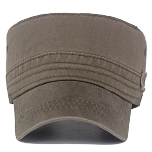 Detailed macro view of army green cadet cap with washed cotton texture and distressed edges