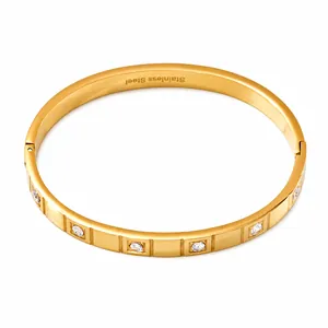 Detail showing 18k gold plated stainless steel bracelet with zircon inlay and clasp