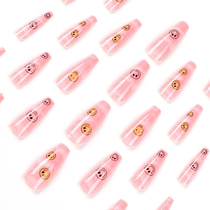 Pink jelly long ballerina press-on nails featuring classic yellow smiley face patterns