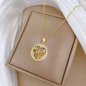 Close-up of gold chain necklace featuring a Mom pendant with sparkling rhinestones