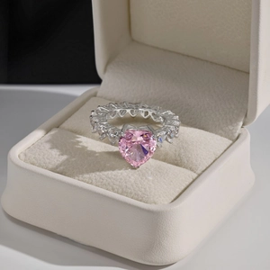 Detailed macro view of S925 silver ring featuring pink heart zircon in a jewelry box