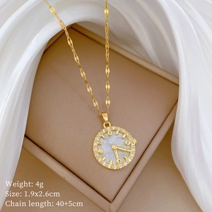 Close-up of golden shell clock necklace in jewelry box with size and weight parameters