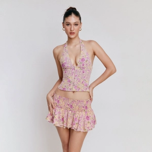 Floral halter top with V-neck and matching pleated mini skirt set for women in pink