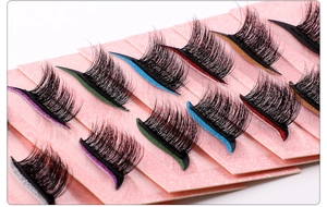 Macro view of multi-color glitter band false eyelashes with thick black synthetic fibers