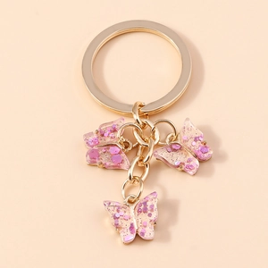 Pink acrylic butterfly keychain with glitter sequins and gold ring for handbags