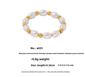 Detail of beaded ring with white faux pearls and gold-plated stainless steel beads