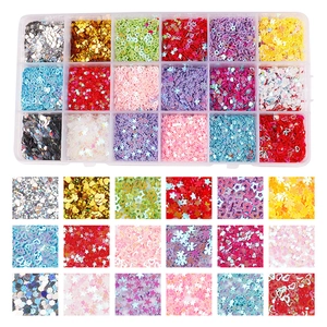 Vue détaillée de la boîte de 24 compartiments remplie de paillettes colorées aux formes variées