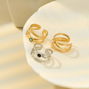 Three-piece titanium steel geometric rings set with vibrant gemstones and shell tray display