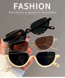 Close-up of leopard print and cream semi-rimless sunglasses with metal frame details