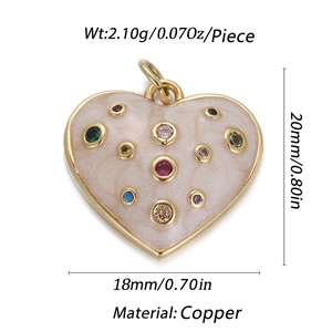 Detailed view of beige enamel heart charm with multi-color zircon stones and copper frame