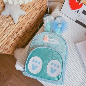 Detail of light blue sequin rabbit backpack with cute bunny ears and bow for kids