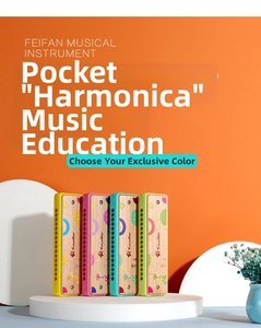 Detail view of 16-hole wooden harmonicas with colorful cartoon patterns and smooth edges
