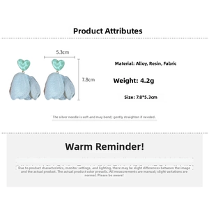 Detailed view of light blue chiffon flower earrings with resin hearts and product dimensions