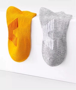 Close-up of breathable knit texture and geometric stripe logo on sports crew socks