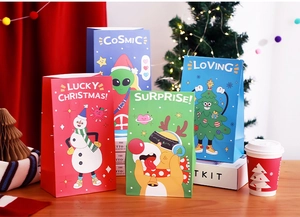Detail of colorful cartoon Christmas gift bags with snowman and reindeer illustrations