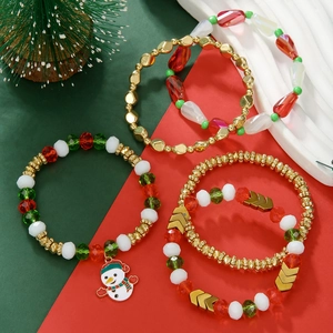 Christmas beaded bracelet set with snowman charm and festive red green crystal beads