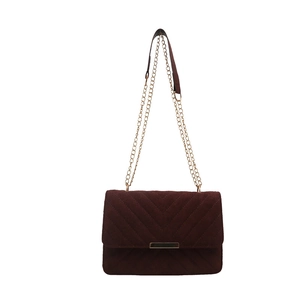 Deep brown quilted crossbody bag with luxury gold chain strap and elegant metal clasp