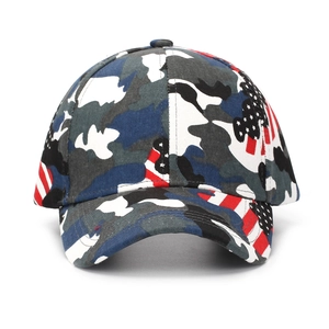 Detail of camouflage baseball cap with American flag patch and durable stitched fabric