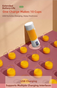 Detail of portable USB juicer with indicator light showing 10-cup battery capacity
