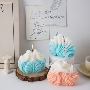 Detail of geometric wave candle with blue-white gradient and Best Wishes ribbon