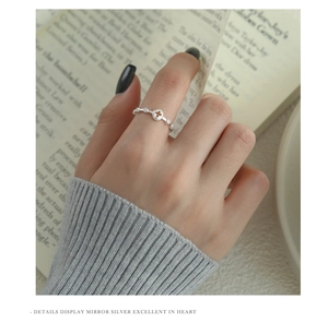 Detail showing cross design and zircon inlay on S925 silver ring worn on hand