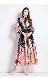 Detail of vintage floral maxi dress featuring high neck collar and gold ring belt buckle