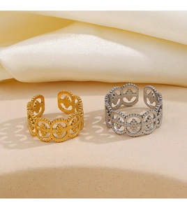 Close-up of gold and silver Roman style open rings with delicate filigree clover patterns
