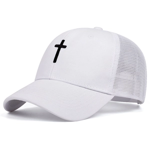 Detail of cross embroidery on a white mesh trucker hat with 45-degree side view