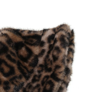 Close-up of leopard print faux fur texture and soft plush fibers on the winter bucket hat