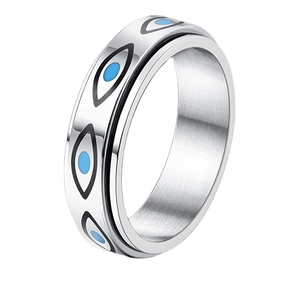 Spinner ring in stainless steel featuring blue evil eye symbols and a rotating band