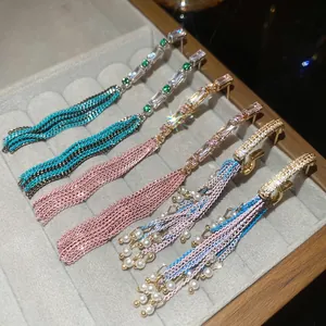 Elegant silver needle heart pearl tassel earrings with zircon in various colors on velvet