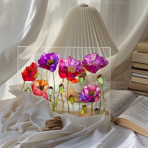 Artistic desktop acrylic floral board with vibrant red poppy and lamp decor background