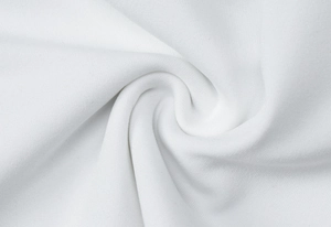 Detailed macro shot of premium white cotton fabric texture and soft weave structure