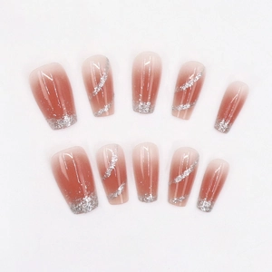 Medium coffin press-on nails with red-brown gradient finish and silver glitter diagonal stripes