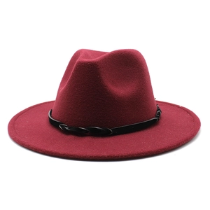 Detail of dark red wool fedora hat featuring a black braided leather decorative band