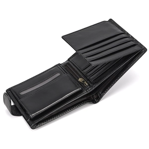 Interior detail of black leather trifold wallet showing card slots and zipper pocket