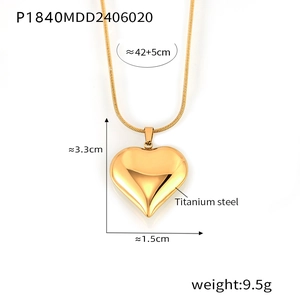Close-up of golden titanium heart pendant with snake chain and exact size dimensions