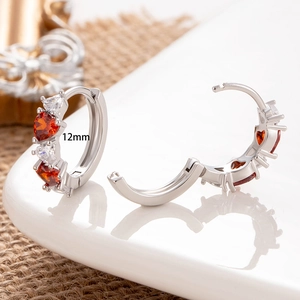 Silver 12mm hoop earrings featuring red heart-shaped zircon and clear stones