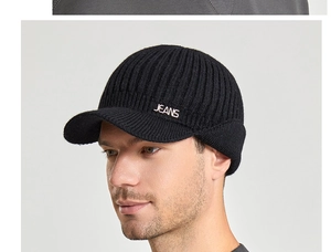 Detail of winter knit visor beanie with ear flaps and silver JEANS letter decor