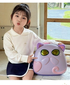 Detail of purple cartoon cat hardshell backpack with heart and window for kids
