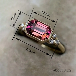 Vintage gold engagement ring with a large rectangular ruby stone and side diamonds