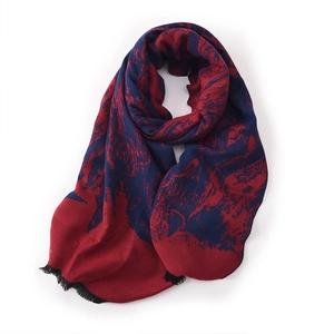 Deep red and navy blue knitted scarf with abstract patterns and tassel details