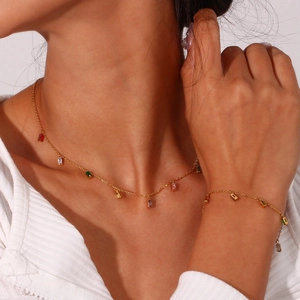 Minimalist gold necklace and bracelet set with colorful rectangular cubic zirconia stones