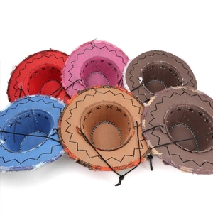 Detail of bohemian cowboy hats showing frayed edges and wavy contrast stitching finish