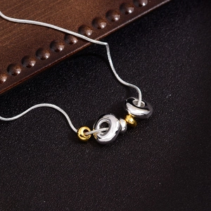 Minimalist gold and silver beaded snake chain necklace with a sleek mirror finish