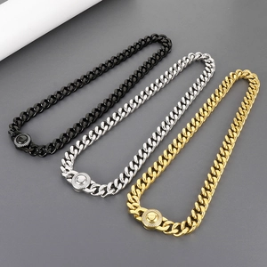 Detailed view of 11mm Cuban link chains in black, silver, and gold steel finishes