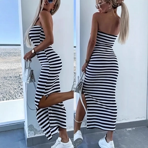 Detail of striped tube dress featuring a high side slit and slim fit knitted fabric